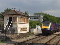 Pencoed Crossing Ground Frame is seen on July 11th 2005 as the 11.30 Swansea to Paddington speeds past